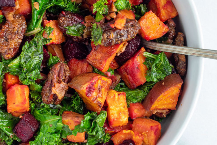 Sweet Potato Beet Kale Salad in white serving bowl with spoon