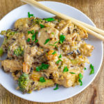 Almond Butter Coconut Curry Chicken on White Plate with Chopsticks