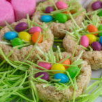 rice krispie easter nests with pink marshmallow bunnies in the background